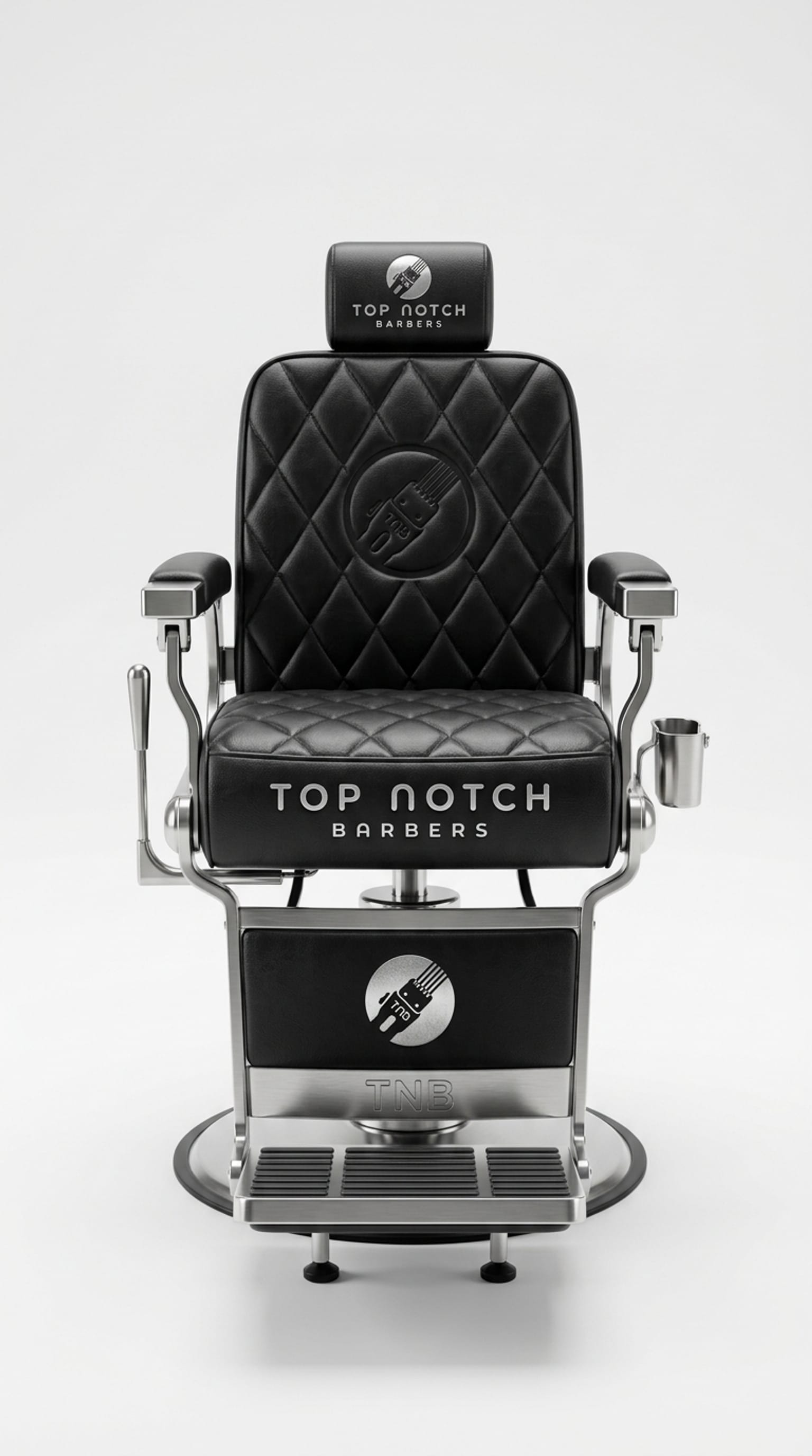 Black leather barber chair embossed with the Top Notch Barbers logo, at our Plainview, Long Island barber shop